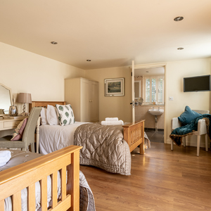 Mandarin - Ground floor bedroom with en—suite wet shower room - door leading to the Terrace